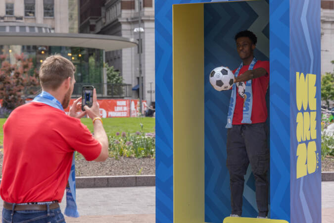 Starfinder soccer club player Khalil Sergeant, 16, posed as an action figure at LOVE park on May 18, 2023. (Kimberly Paynter/WHYY)
