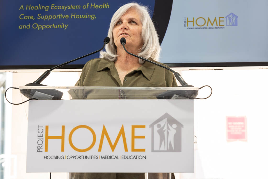 Joan Dawson McConnon, Associate Executive Director of Project, speaks at a podium.