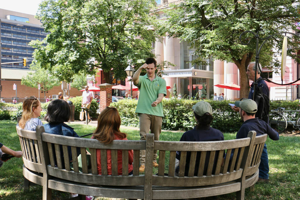 2023 05 25-e lee-ken sandberg-philadelphia signers garden-once upon a nation storytelling benches training Ken Sandberg performs in front of a crowd.
