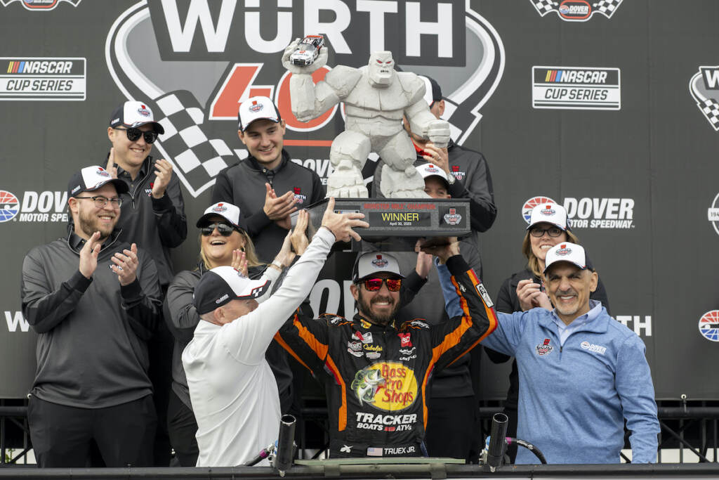 NASCAR Dover Auto Racing Martin Truex Jr. hoists the trophy after winning the NASCAR 400 auto race at Dover Motor Speedway, Monday