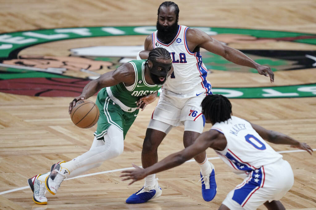 76ers Celtics Basketball Boston Celtics guard Jaylen Brown (left) drives between Philadelphia 76ers' James Harden and Tyrese Maxey (0) during the first half of Game 2 in the NBA basketball Eastern Conference semifinals playoff series, Wednesdayv