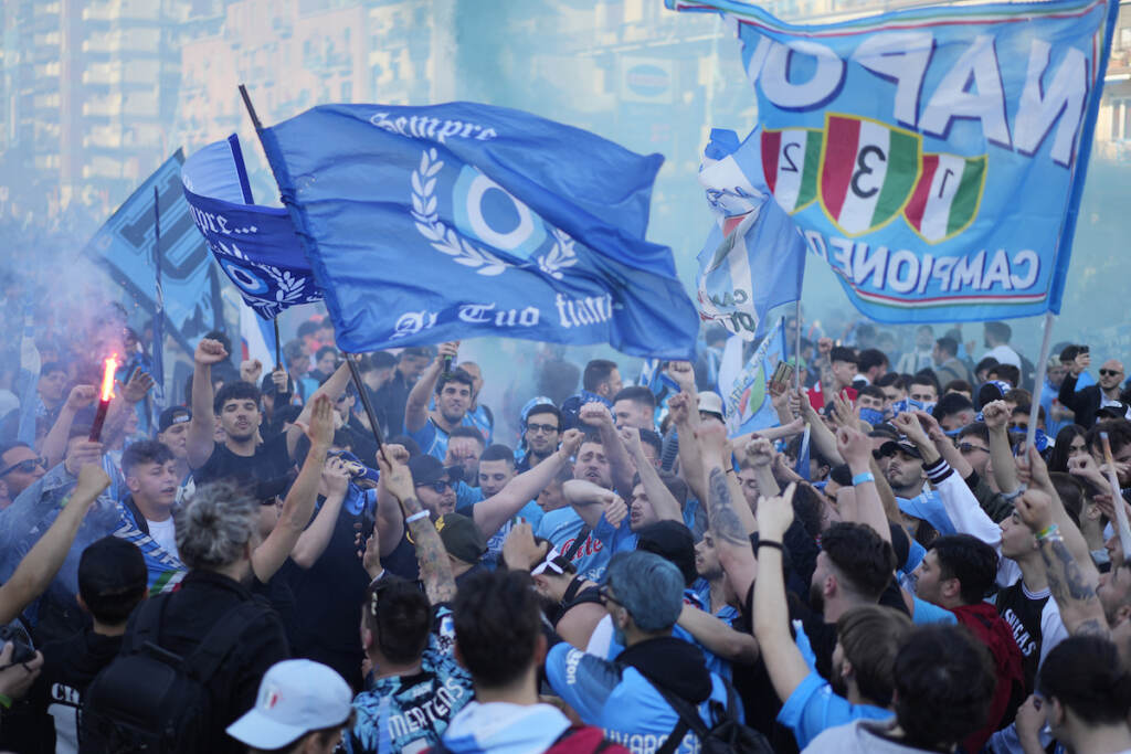 Italy Napoli Soccer Napoli fans cheer in front of the Diego Armando Maradona stadium, in Naples, Italy