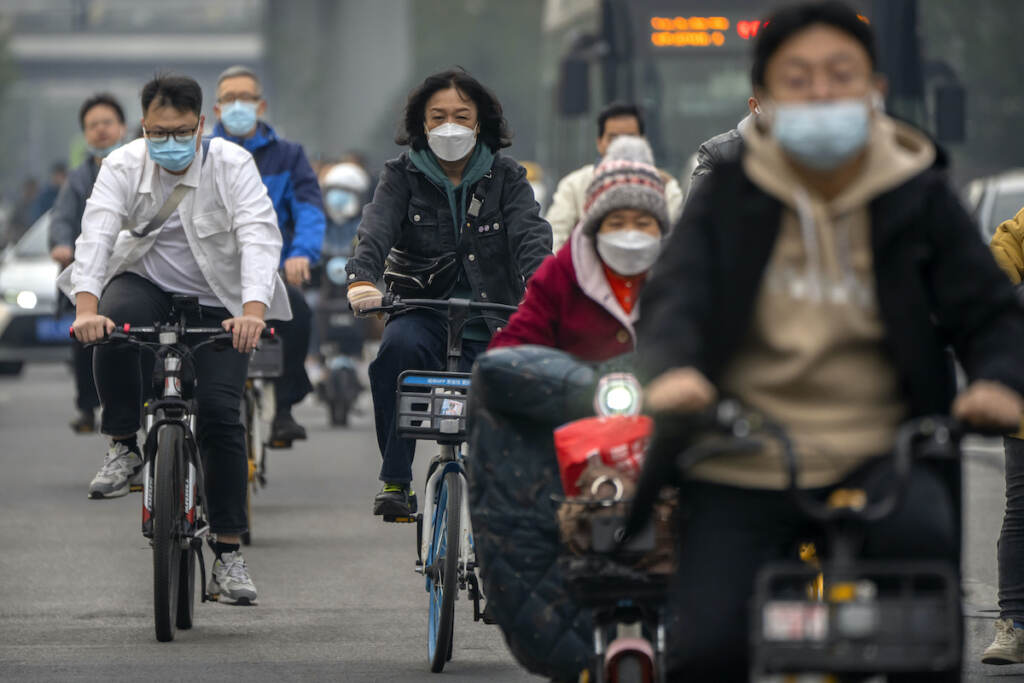 WHO Pandemic Explainer Commuters wearing face masks ride bicycles along a street in the central business district in Beijing, Thursday, Oct. 20, 2022. The World Health Organization downgraded its assessment of the coronavirus pandemic on Friday, May 5, 2023, saying it no longer qualifies as a global emergency.
(AP Photo/Mark Schiefelbein, File)