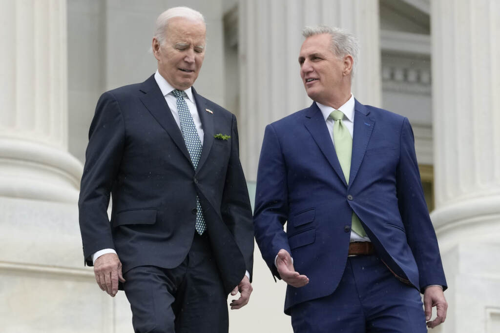 President Joe Biden talks with House Speaker Kevin McCarthy of Calif., as they walk down the House steps as they leave after attending an annual St. Patrick's Day luncheon gathering at the Capitol in Washington, March 17, 2023. The Tuesday, May 9, White House sitdown between the president and congressional leaders will be the first substantive talks between Biden and McCarthy in months, and comes weeks after House Republicans voted on a bill that would raise the debt limit but impose significant federal spending cuts
