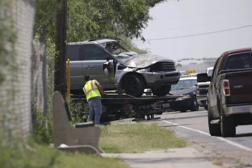 Deadly Bus Stop Crash Emergency personnel take away a damaged vehicle after a fatal collision in Brownsville, Texas, on Sunday, May 7, 2023. Several migrants were killed after they were struck by a vehicle while waiting at a bus stop near Ozanam Center, a migrant and homeless shelter.
