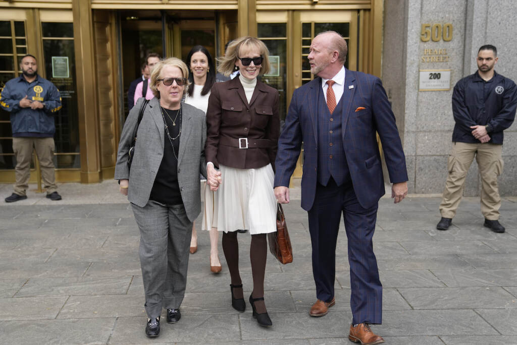 CORRECTION Trump Columnist Lawsuit E. Jean Carroll, center, walks out of Manhattan federal court, Tuesday, May 9, 2023, in New York