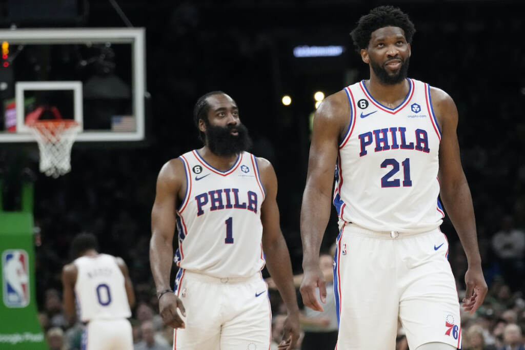 76ers Celtics Basketball Philadelphia 76ers center Joel Embiid (21) smiles while walking down court with James Harden (1) during the second half of Game 5 in the NBA basketball Eastern Conference semifinals playoff series against the Boston Celtics
