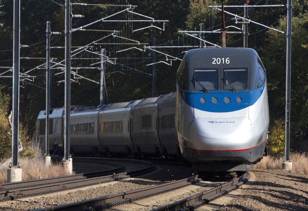 Northeast Corridor Redesign In this Oct. 18, 2016 file photo, an Amtrak Acela train travels through Old Lyme, Conn. On Friday, Dec. 16 federal railroad regulators endorsed an ambitious and costly plan to rebuild the congested Northeast Corridor over the next 30 years. The plan recommends a tunnel through Old Lyme after residents complained about the prospect of elevated tracks. (AP Photo/Michael Dwyer)