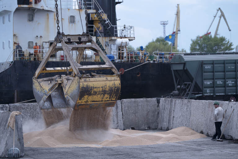 Workers load grain at a port in Izmail, Ukraine, on April 26. A United Nations-backed deal has been extended allowing shipments of Ukrainian grain through the Black Sea to parts of the world struggling with hunger.