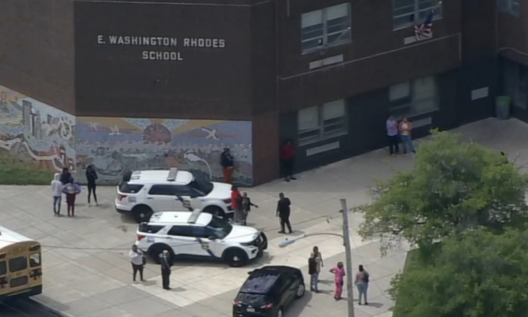 Police cars outside of E.W. Rhodes Elementary School