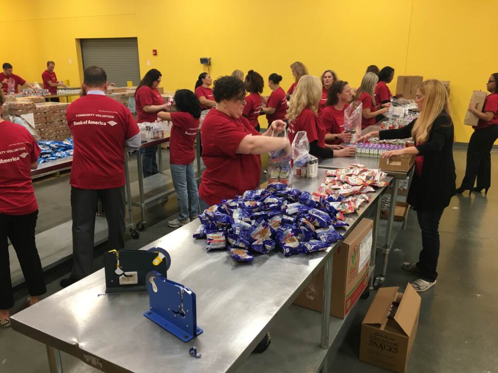 food-bank-delaware-m-eichmann-04-15-19 Volunteers sorting food at a food bank.