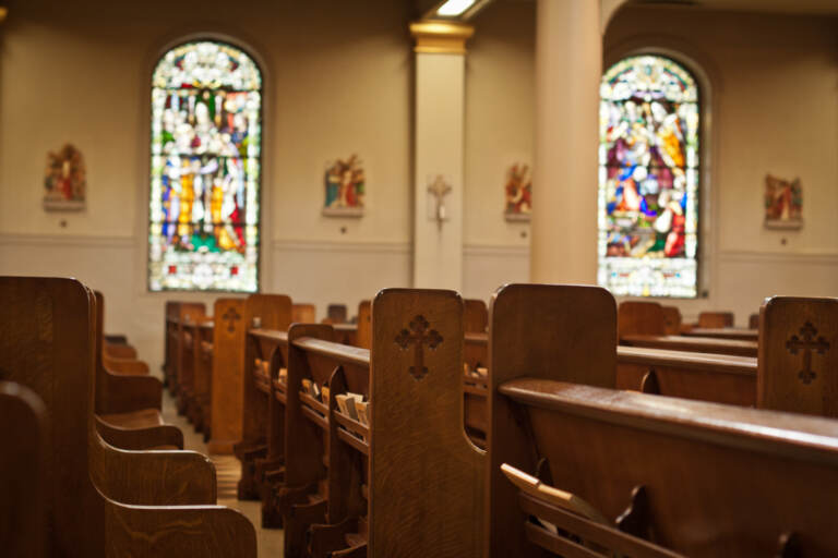 Inside of a church with stained glass windows