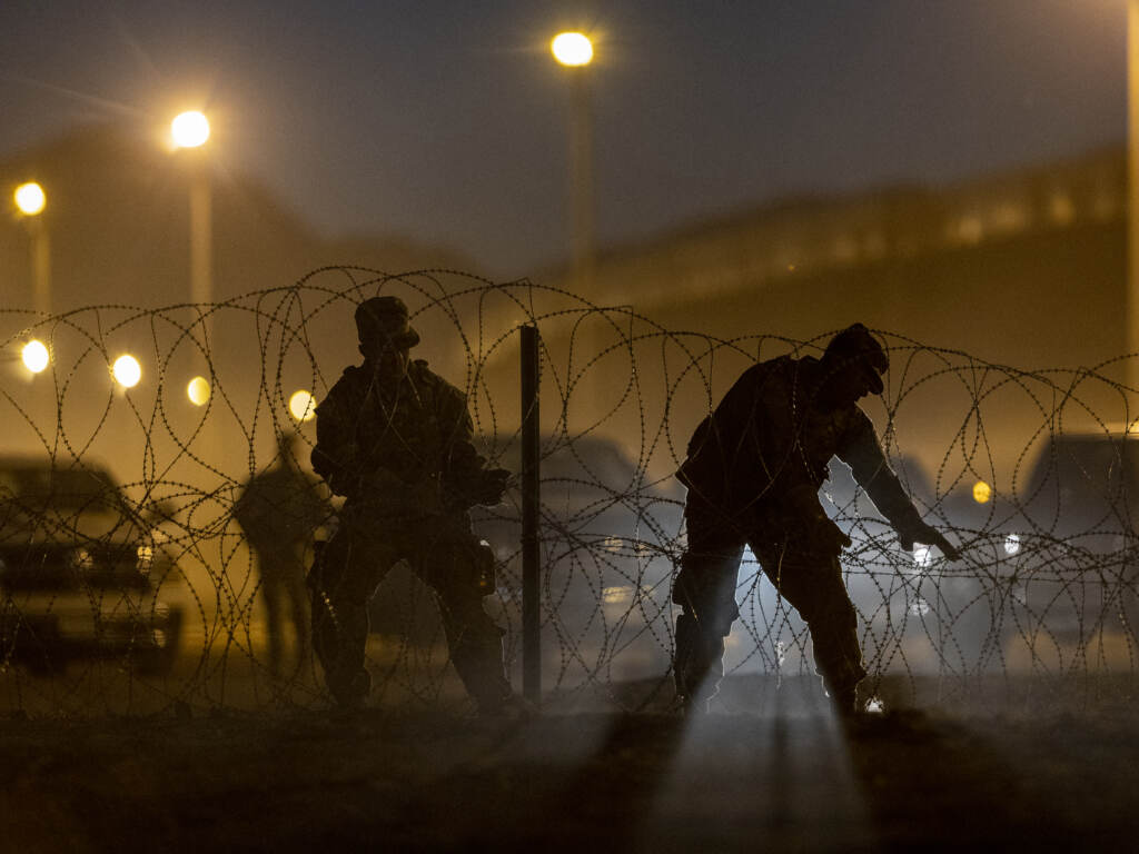 Texas National Guard troops set up razor wire in El Paso, Texas. Officials are anticipating a wave of immigrants on Thursday night, with the end of the U.S. government’s COVID-era Title 42 policy. Texas National Guard troops set up razor wire in El Paso, Texas. Officials are anticipating a wave of immigrants on Thursday night, with the end of the U.S. government's COVID-era Title 42 policy.