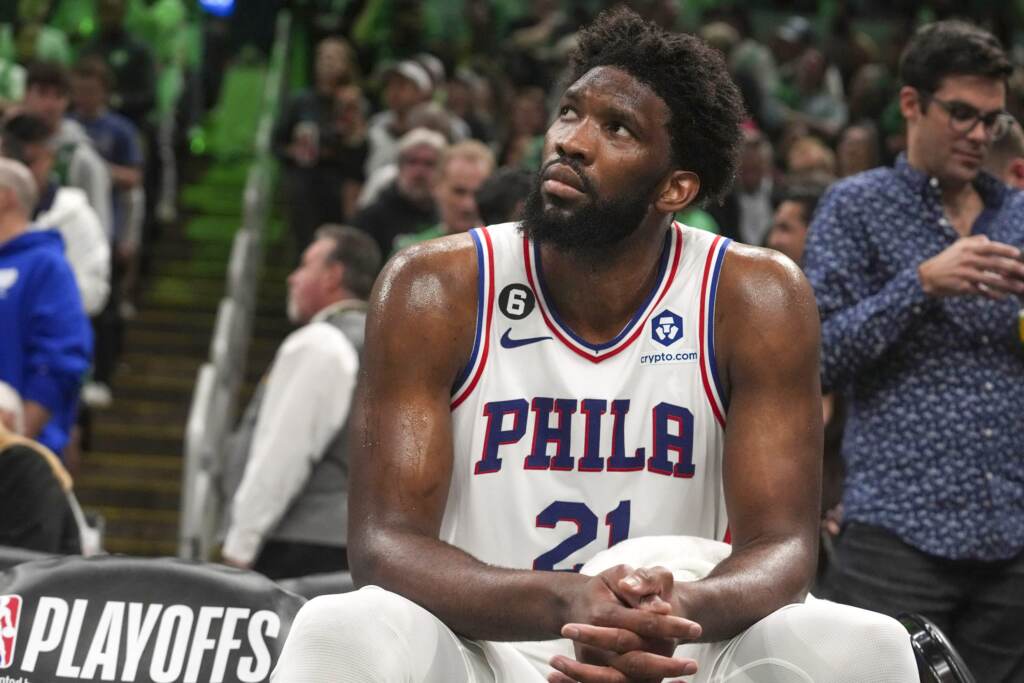 Sixers center Joel Embiid watches from the bench as his team falls behind the Boston Celtics during the second half of Game 7 in the NBA basketball Eastern Conference semifinal playoff series, Sunday, May 14, 2023, in Boston