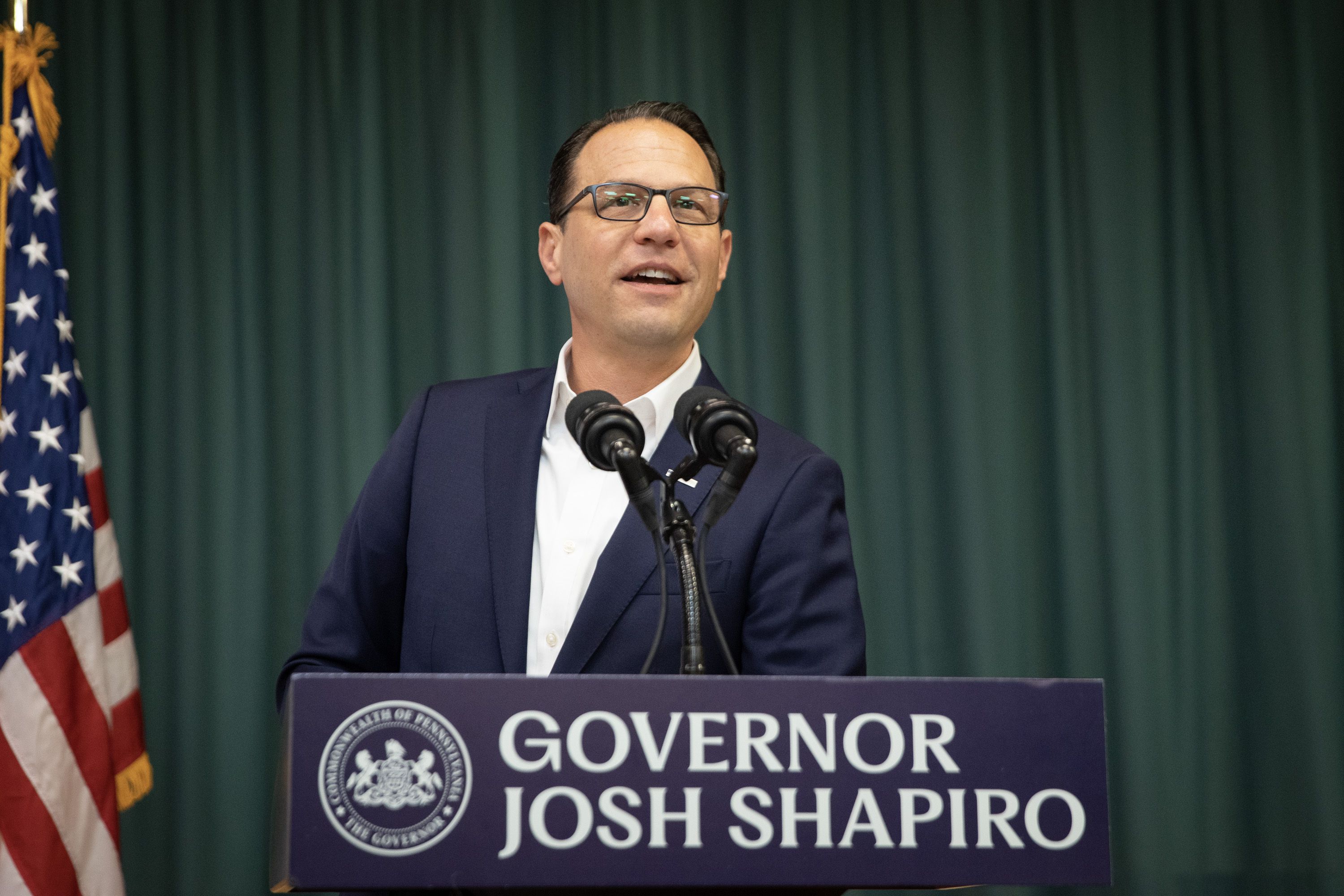 Josh Shapiro speaking at a podium.