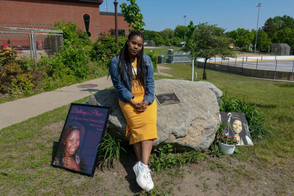 lakeisha-lee_mnmurderblackwomen-1_custom-2fb91f9c256067ec5d7aa3b5da8346b2666966d6-s1600-c85 Lakeisha Lee placed flowers at the base of a monument honoring her late sister Brittany Clardy Thursday, May 26, in Saint Paul. Clardy went missing more than a decade ago and was found murdered.
(Dana Ferguson/MPR News)