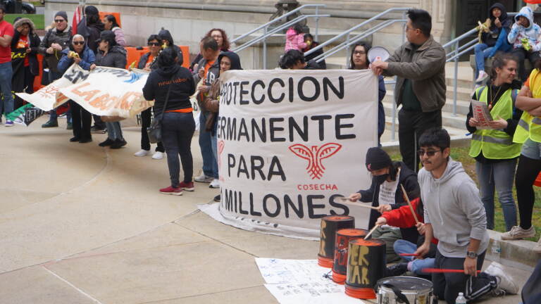 Migrant workers rally at the N.J. Statehouse for May Day, May 1, 2023. (Tennyson Donyéa/WHYY)