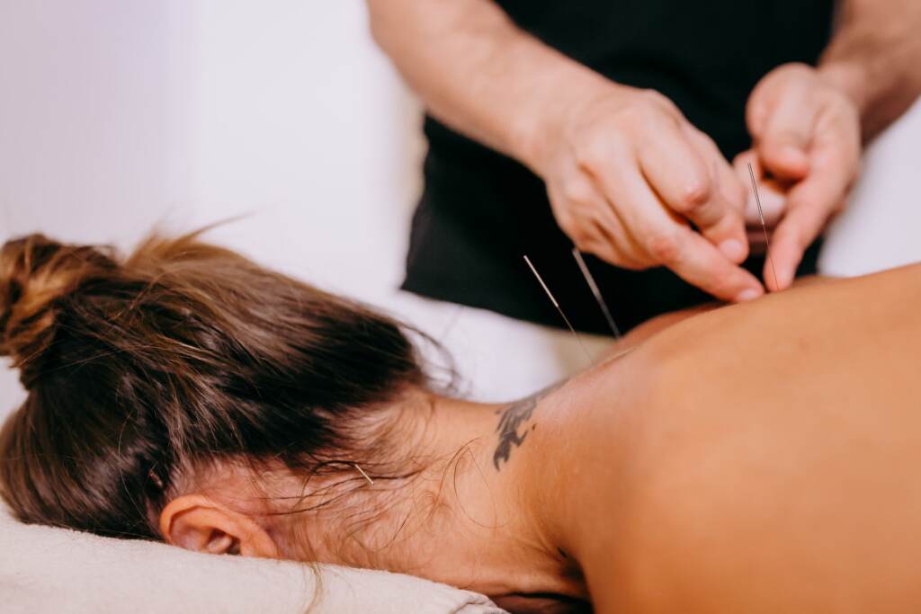 The Pulse 05/12/23 Hands inserting needles on persons back