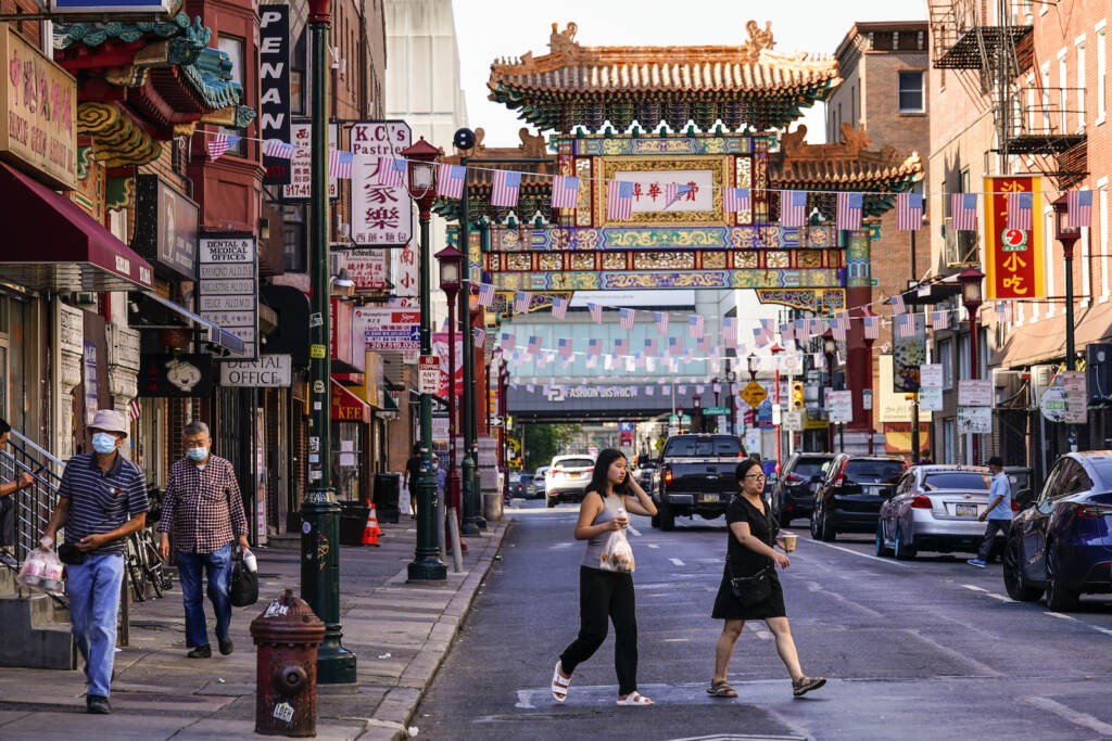 Philadelphia 76ers Arena Chinatown Pedestrians cross 10th Street in the Chinatown neighborhood of Philadelphia