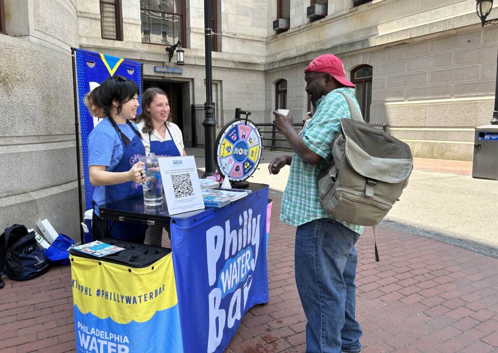 Philadelphians sample tap water at a PWD water bar event