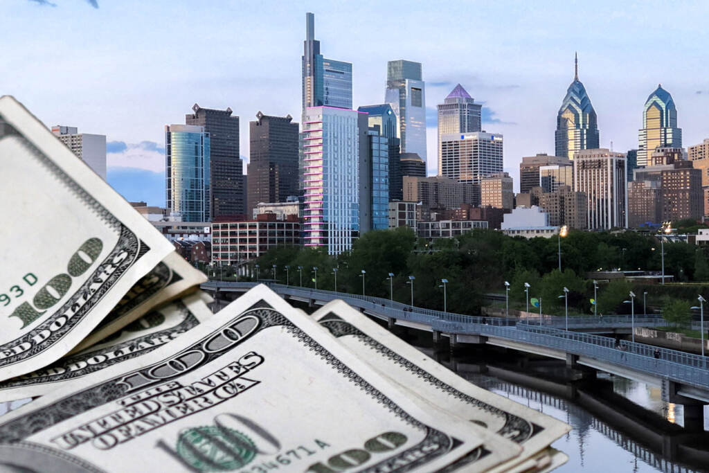 Cash in front of the Philadelphia skyline