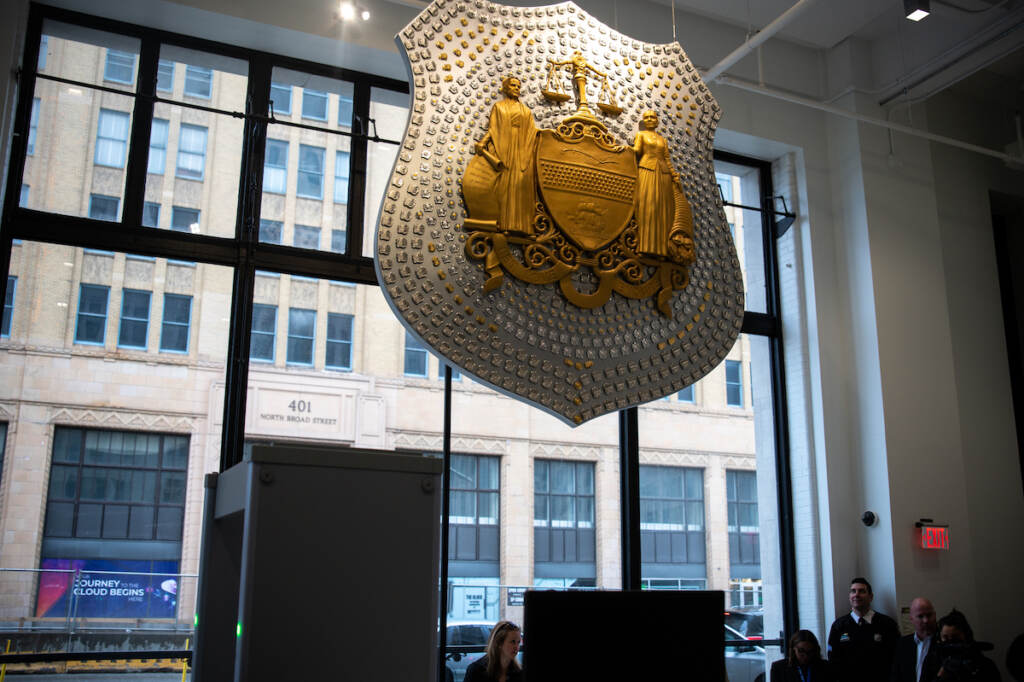 A sculpture by artist Donald Lipski made of 1,400 Philadelphia police badges in the lobby of police HQ in the Philadelphia Public Safety Building, called ''Let Love Endure.''