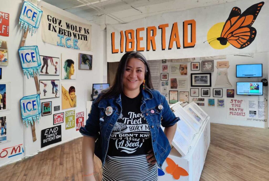 shut-down-berks-art-6 Jasmine Rivera stands in the middle of an art exhibition space.