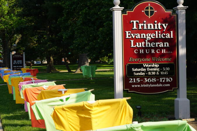 t shirt memorial on a lawn showing names of people killed
