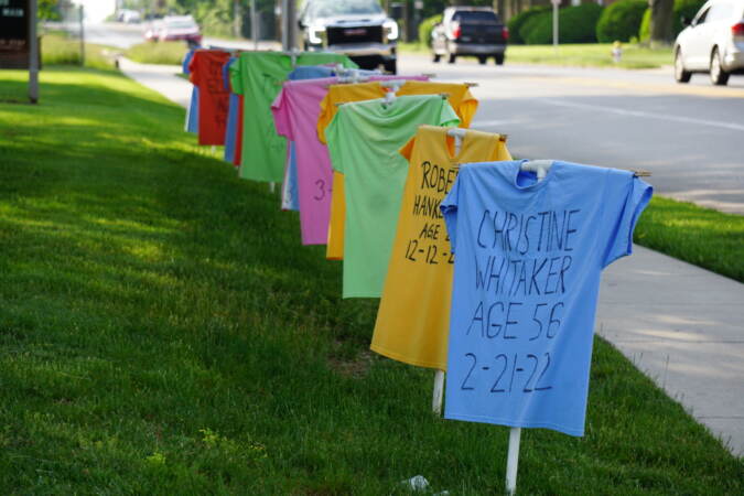 t shirt memorial on a lawn showing names of people killed