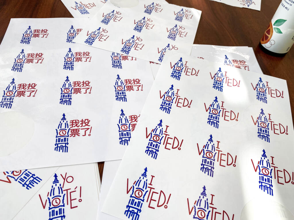 Sheets of Philadelphia ''Voted'' stickers on a table.