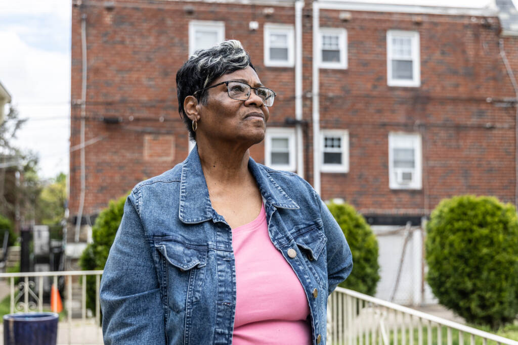 Penny Cooper at her sister’s home in Philadelphia. (Kimberly Paynter/WHYY) Penny Cooper poses for a portrait outside