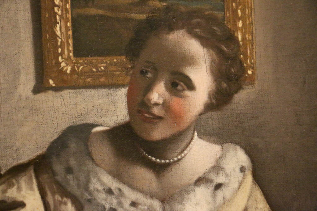 2023 06 09-e lee-philadelphia museum of art-possible vermeer lady with a guitar detail An up-close view of the face of the woman, the guitar player, in the painting,