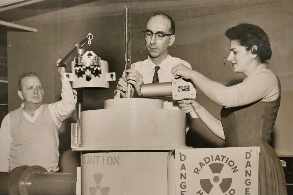 A photograph shows J. Hartley Bowen Jr, (center) at the Naval Air Material Center in Philadelphia in 1958. (The Papers of J. Hartley Bowen Jr. at the Science History Museum)