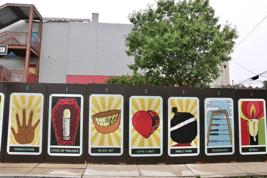 Colorful large tarot cards on the wall