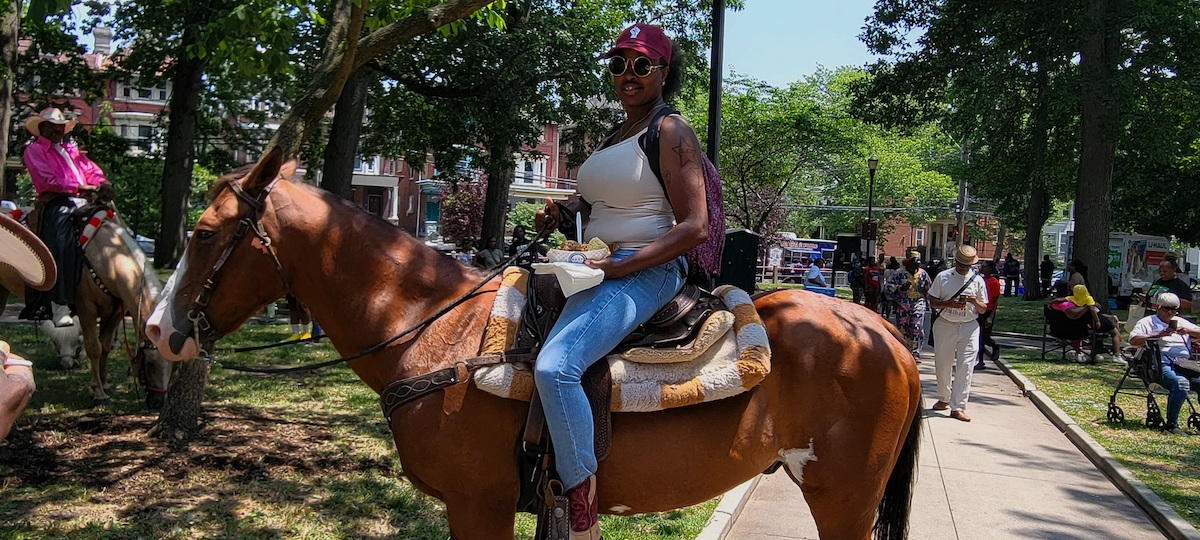 Shannon Hilbert was riding her horse at Malcolm X Park on Sunday for the Juneteenth Festival