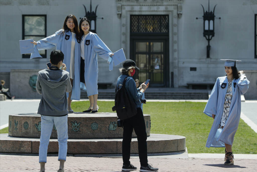 Financial Wellness Student Loan Default Columbia University class of 2020 graduates pose for photographs on Commencement Day on Wednesday, May 20, 2020, in New York.