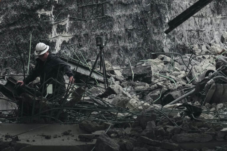 A investigator surveys the aftermath