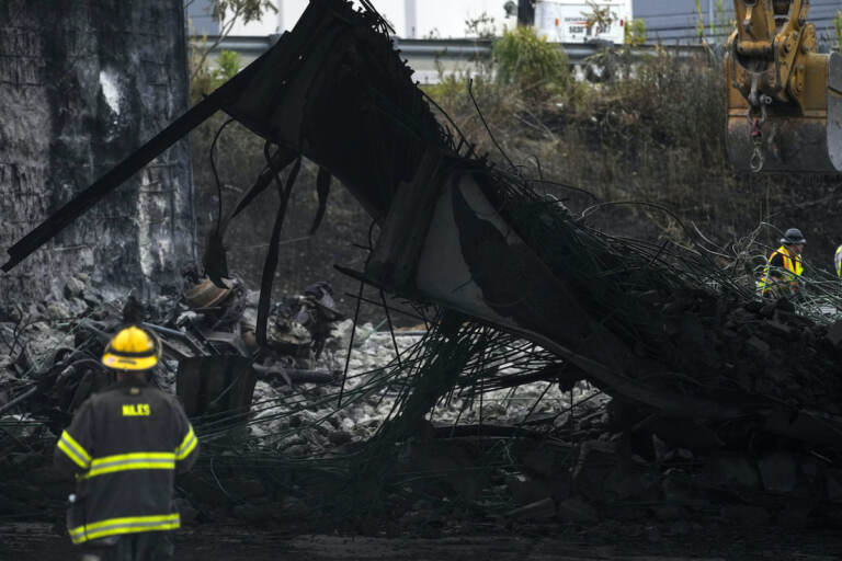 A firefighter views the aftermath