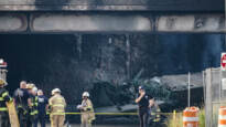 Crews work to contain a tanker fire underneath an Interstate 95 overpass in Philadelphia on Sunday, June 11, 2023