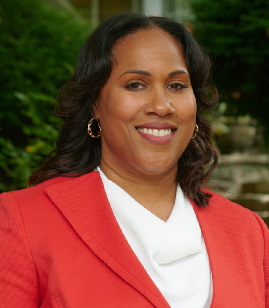 A headshot of Keir Bradford-Grey, smiling as she poses for a photo.