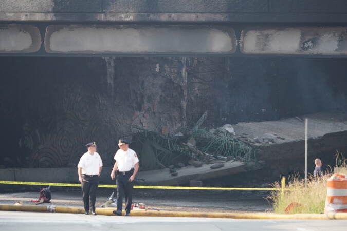 First responders work to extinguish a vehicle fire, Sunday June 11, 2023, that caused an overpass on I-95 to collapse near the Cottman Avenue exit