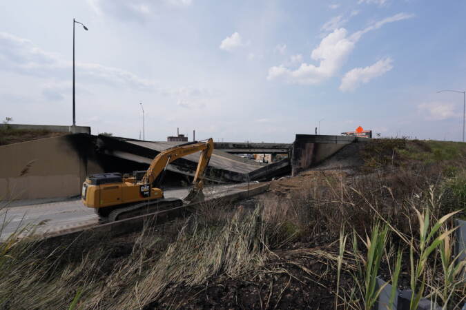 Crews work to remove rubble from a collapsed section of I-95, Sunday June 11, 2023, after a vehicle fire caused an overpass on I-95 to collapse near Cottman Avenue. (Joseph Kaczmarek for WHYY)