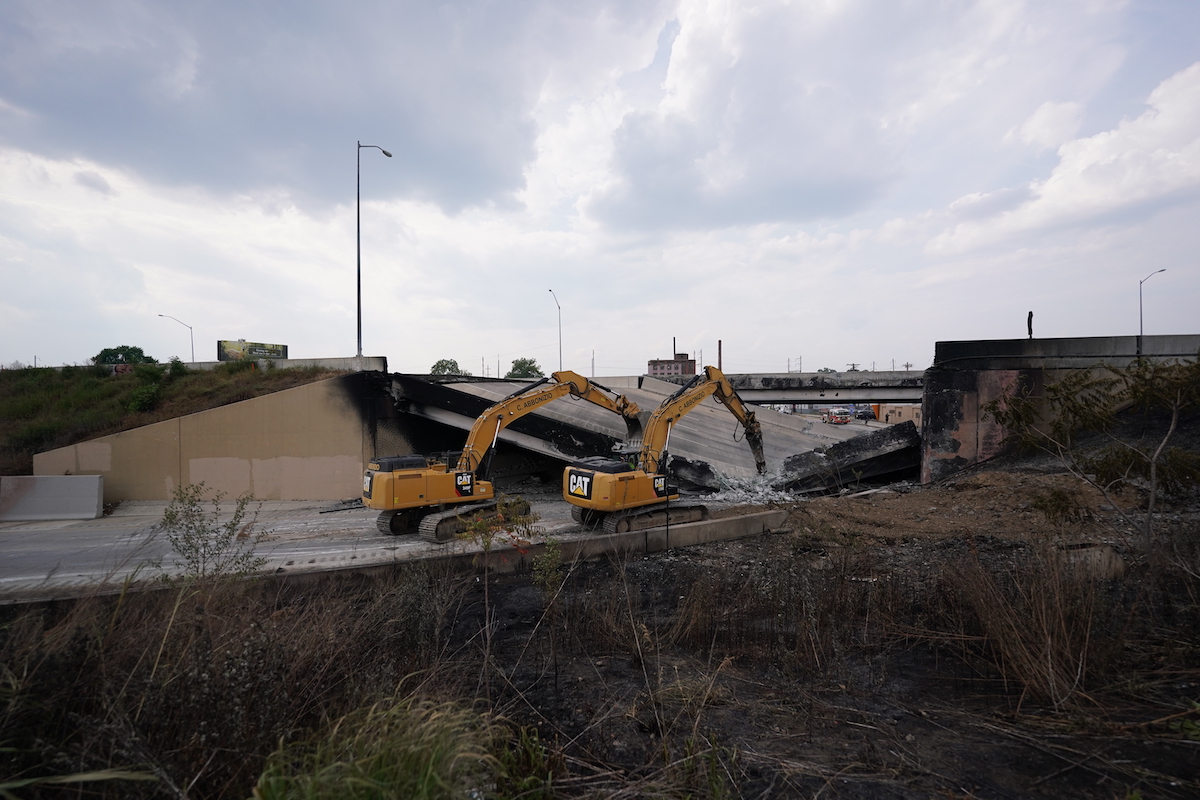 Crews work to remove rubble from a collapsed section of I-95, Sunday June 11, 2023, after a vehicle fire caused an overpass on I-95 to collapse near Cottman Avenue. (Joseph Kaczmarek for WHYY)