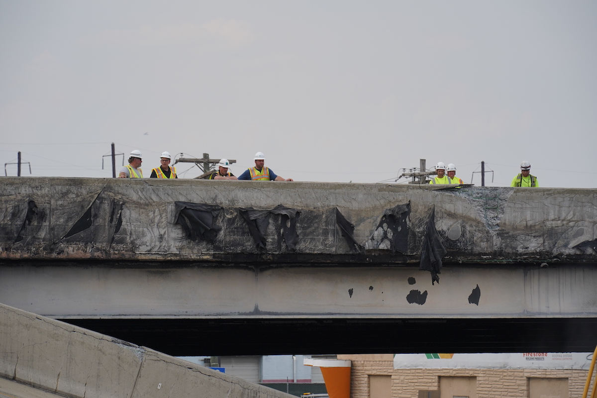 Crews work to remove rubble from a collapsed section of I-95, Sunday June 11, 2023, after a vehicle fire caused an overpass on I-95 to collapse near Cottman Avenue. (Joseph Kaczmarek for WHYY)