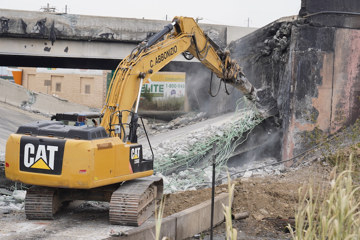 Crews work to remove rubble from a collapsed section of I-95, Sunday June 11, 2023, after a vehicle fire caused an overpass on I-95 to collapse near Cottman Avenue. (Joseph Kaczmarek for WHYY)