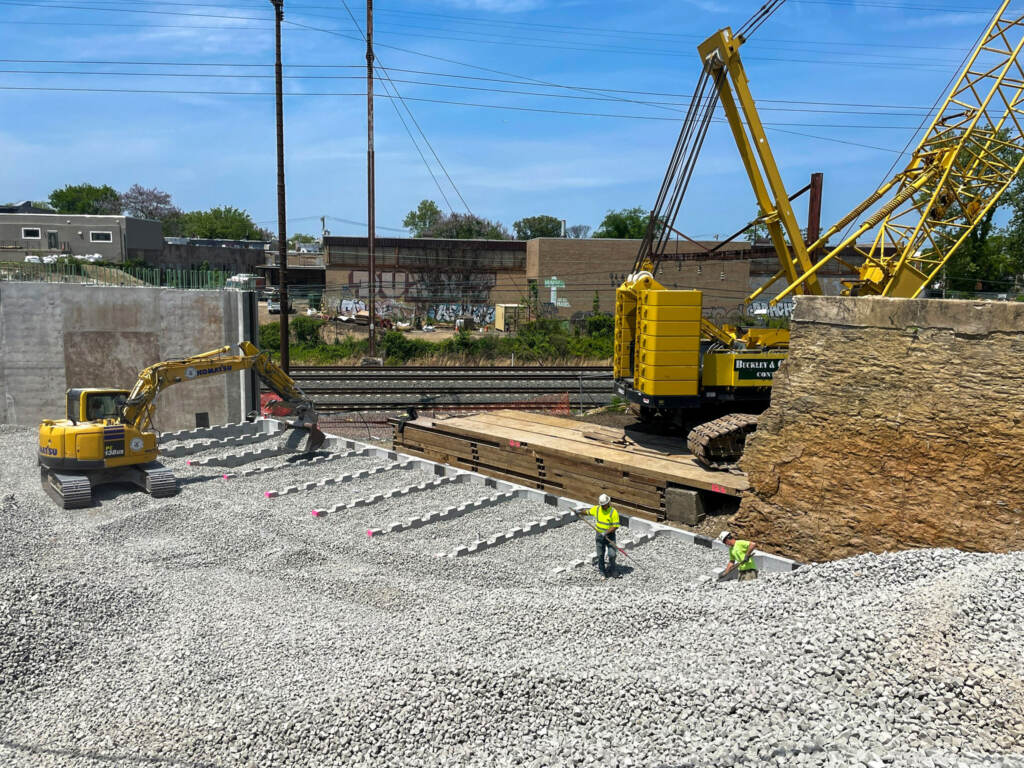 Workers arrange glass foam backfill made by Aero Aggregates in Delaware County to build up an overpass at Montgomery Avenue and 29th Street in Philadelphia