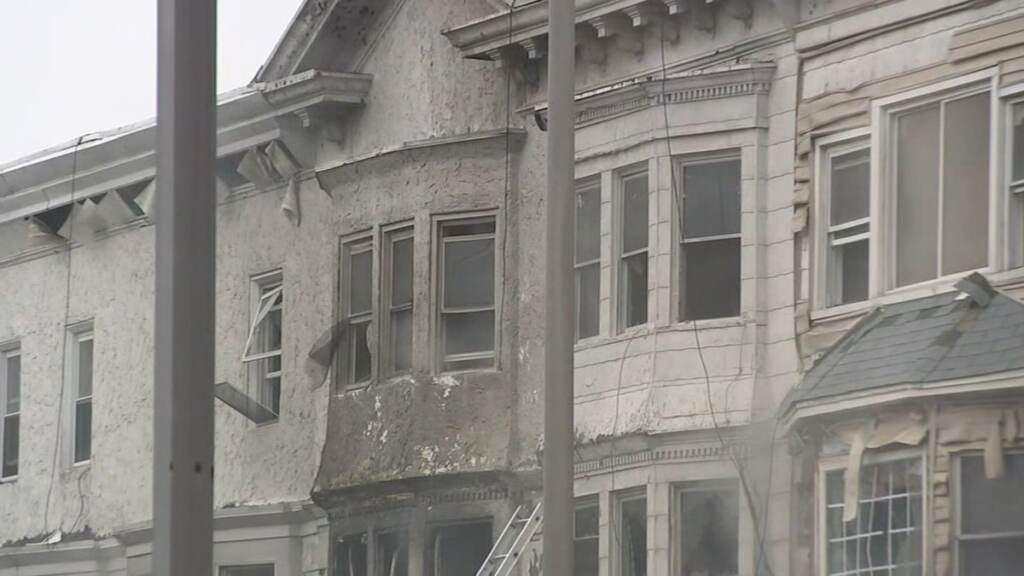 A close-up of buildings with smoke coming out of them.