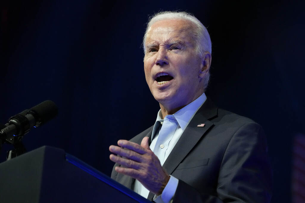 An up-close view of Joe Biden speaking at a podium.