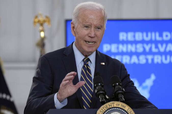 President Biden speaks at a podium.
