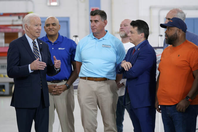 President Biden speaks with officials and union representatives.